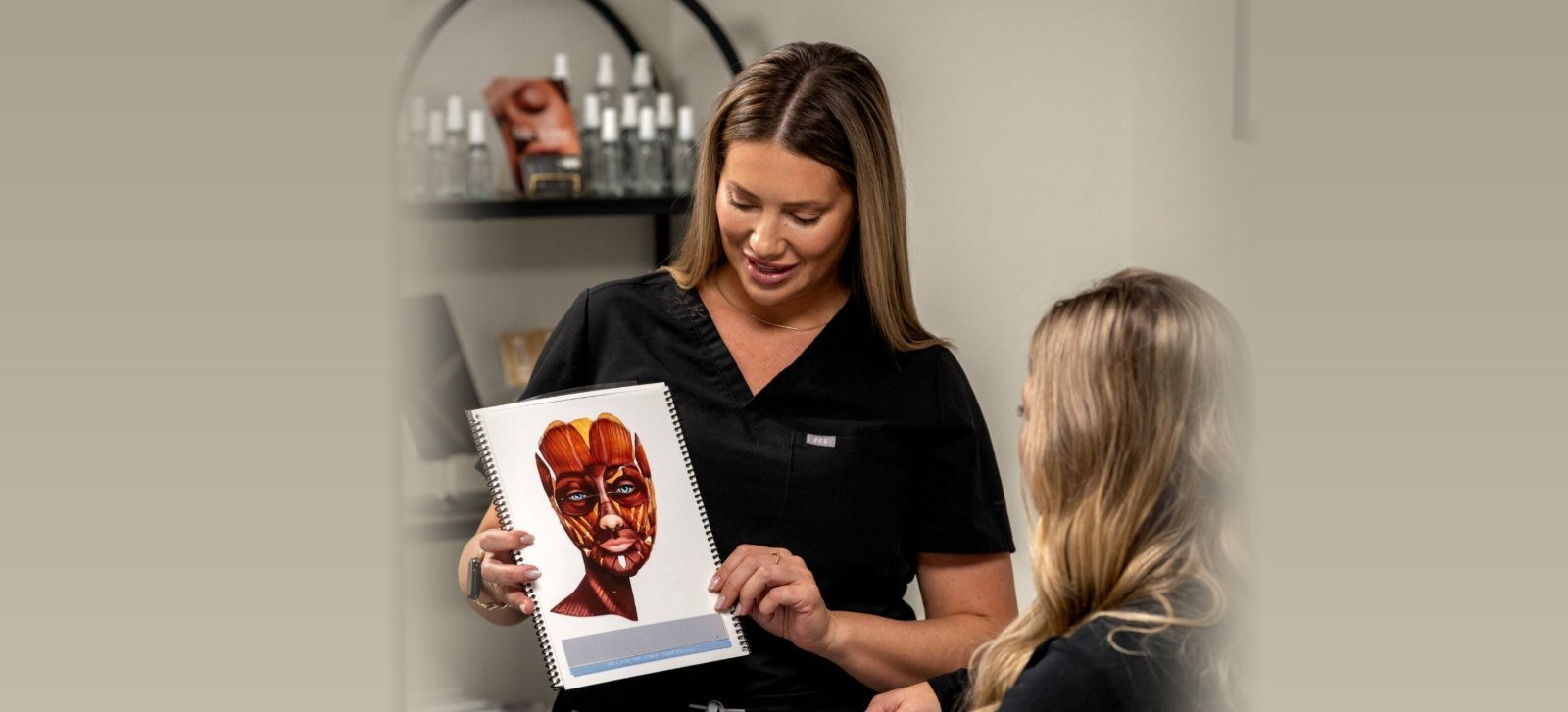 Consultation at Nurse Laura Aesthetics, reviewing facial anatomy with a client