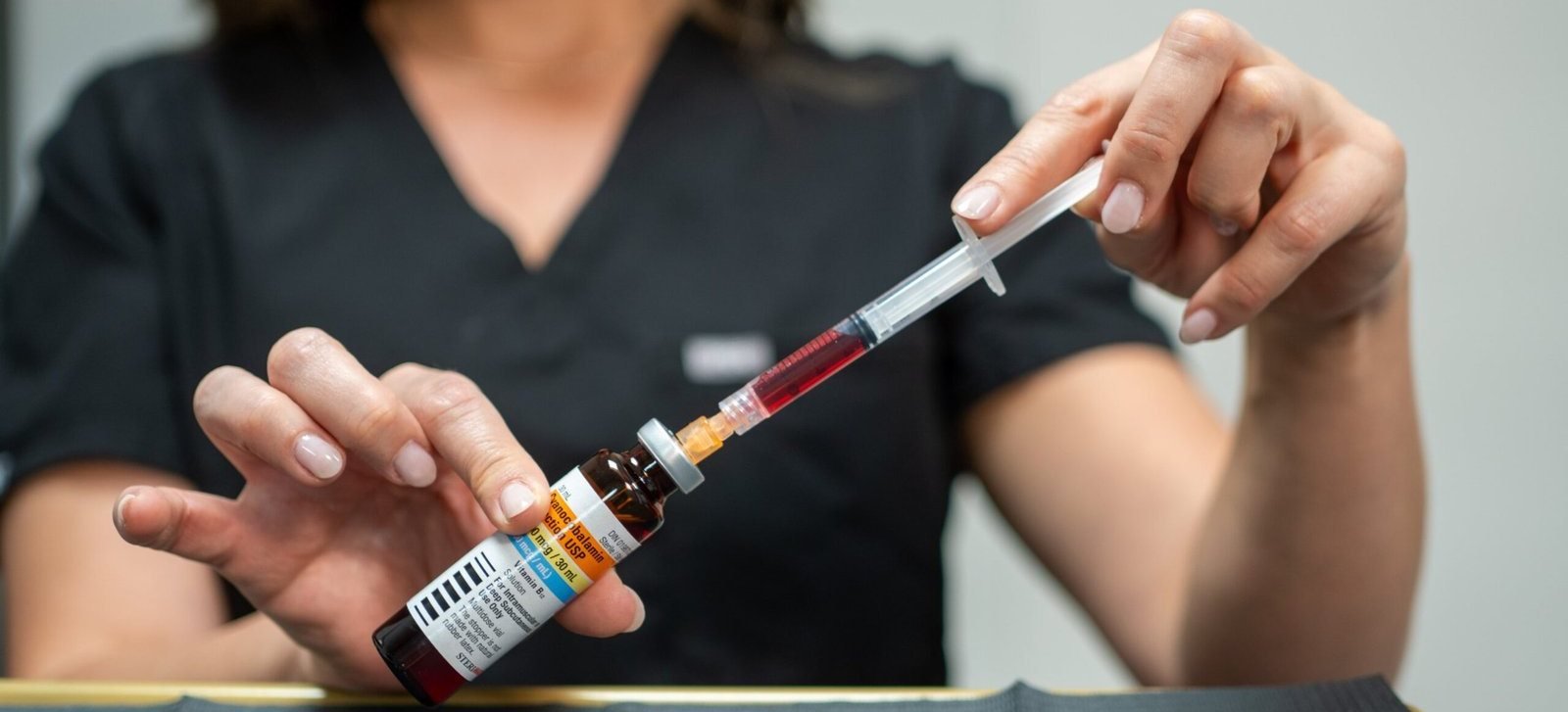 Preparing a vitamin B12 injection at Nurse Laura Aesthetics